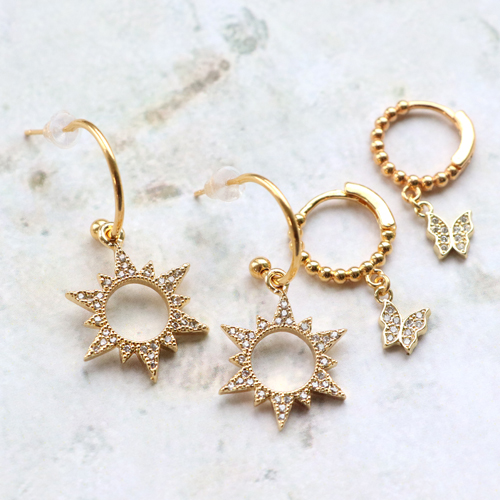 Orecchini e bracciali di tendenza con ciondoli e distanziatori con zirconia: