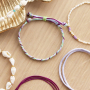 Accessori estivi da realizzare con cordoncino macram&egrave;, perle d&rsquo;acqua dolce e perline a forma di conchiglia:
