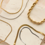 Combina collane e bracciali in acciaio inossidabile